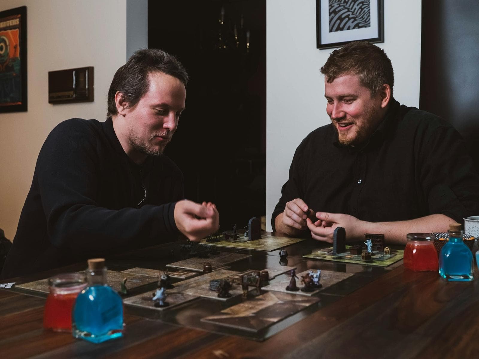 Two friends concentrating over a board game