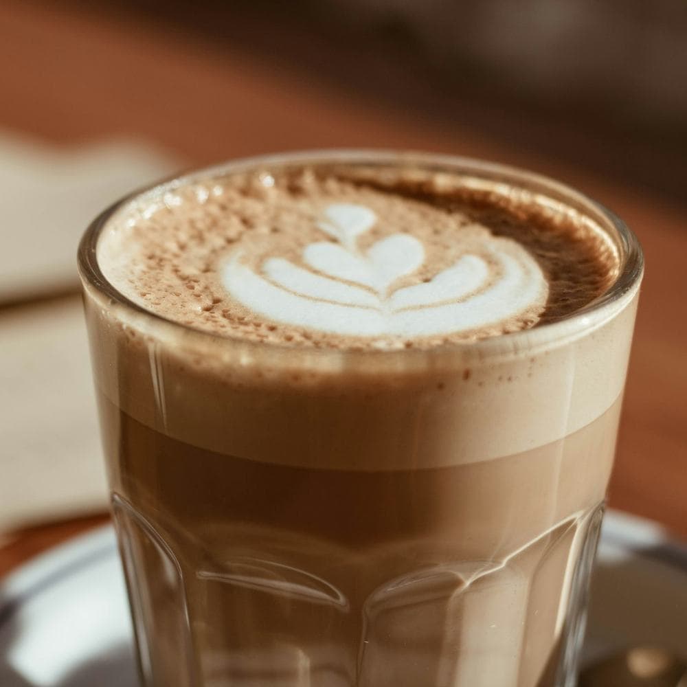 Hazelnut cortado in a glass with a layered pour
