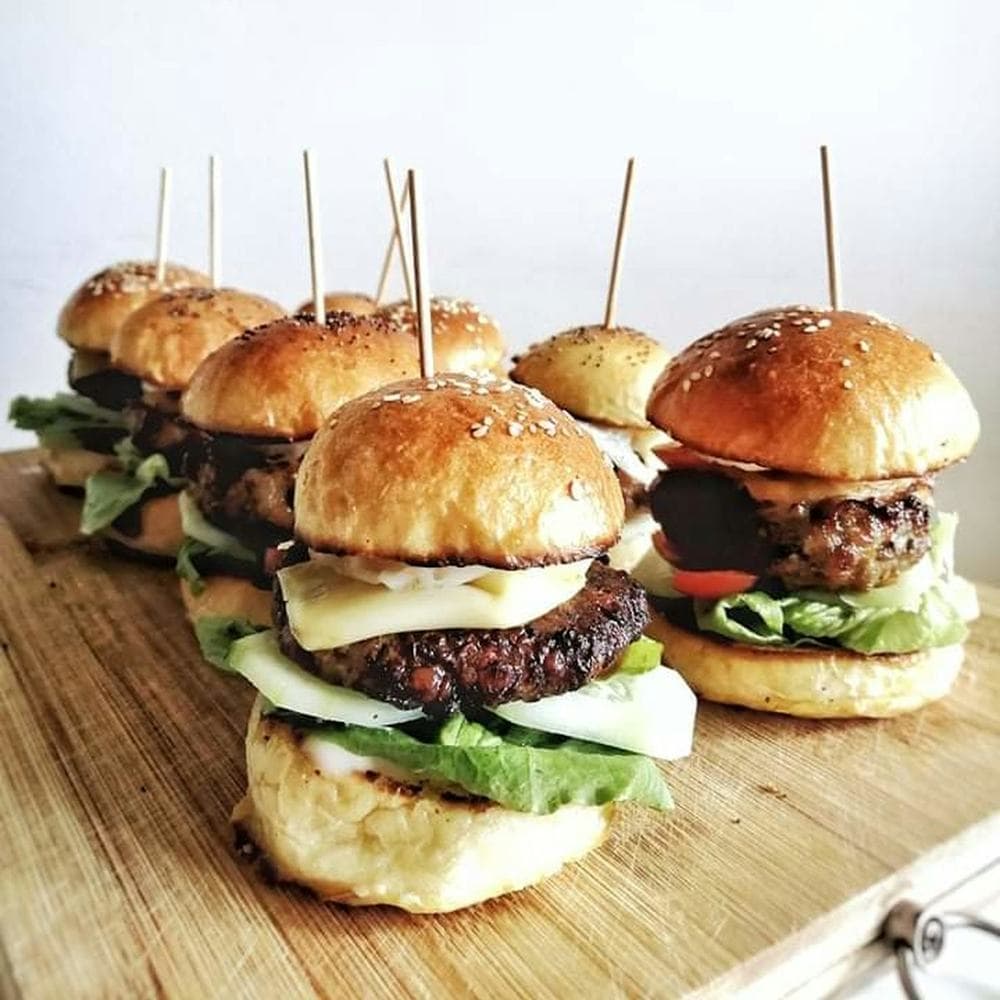 Keema pav sliders lined up on a board