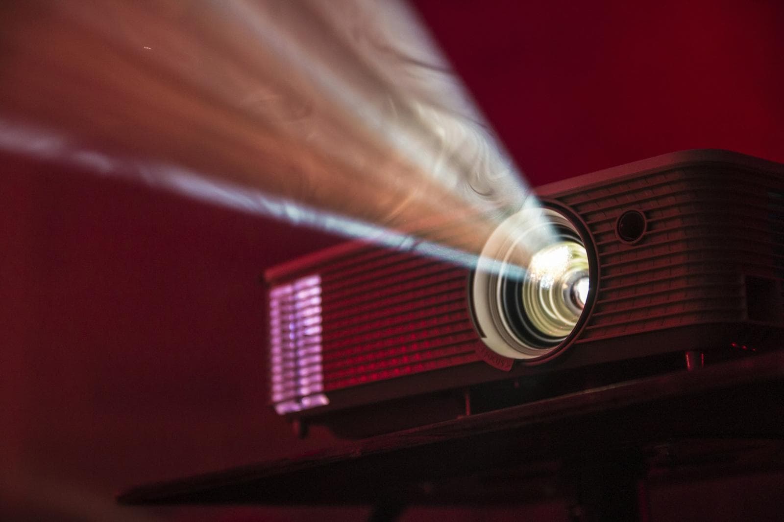 Projector beam cutting through a dark room
