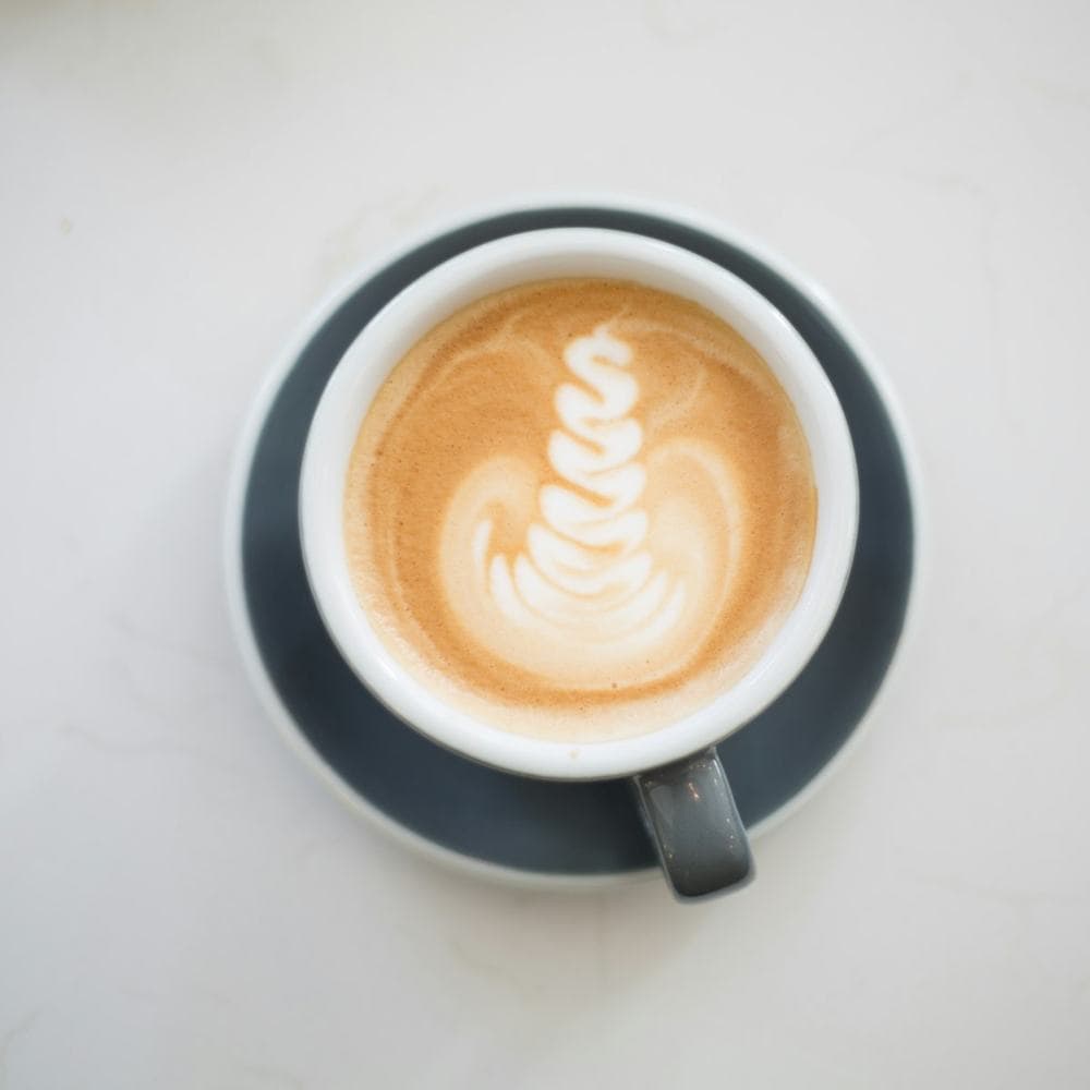 Cappuccino with latte art, seen from above