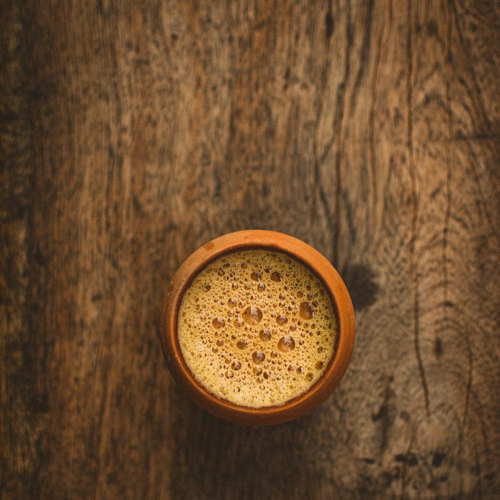 Masala chai in a clay cup, seen from above