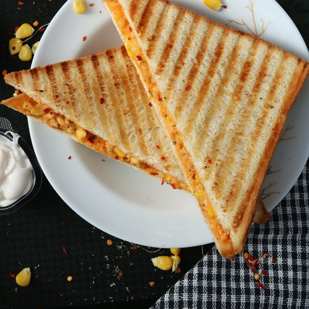 Toasted paneer sandwich halves on a plate