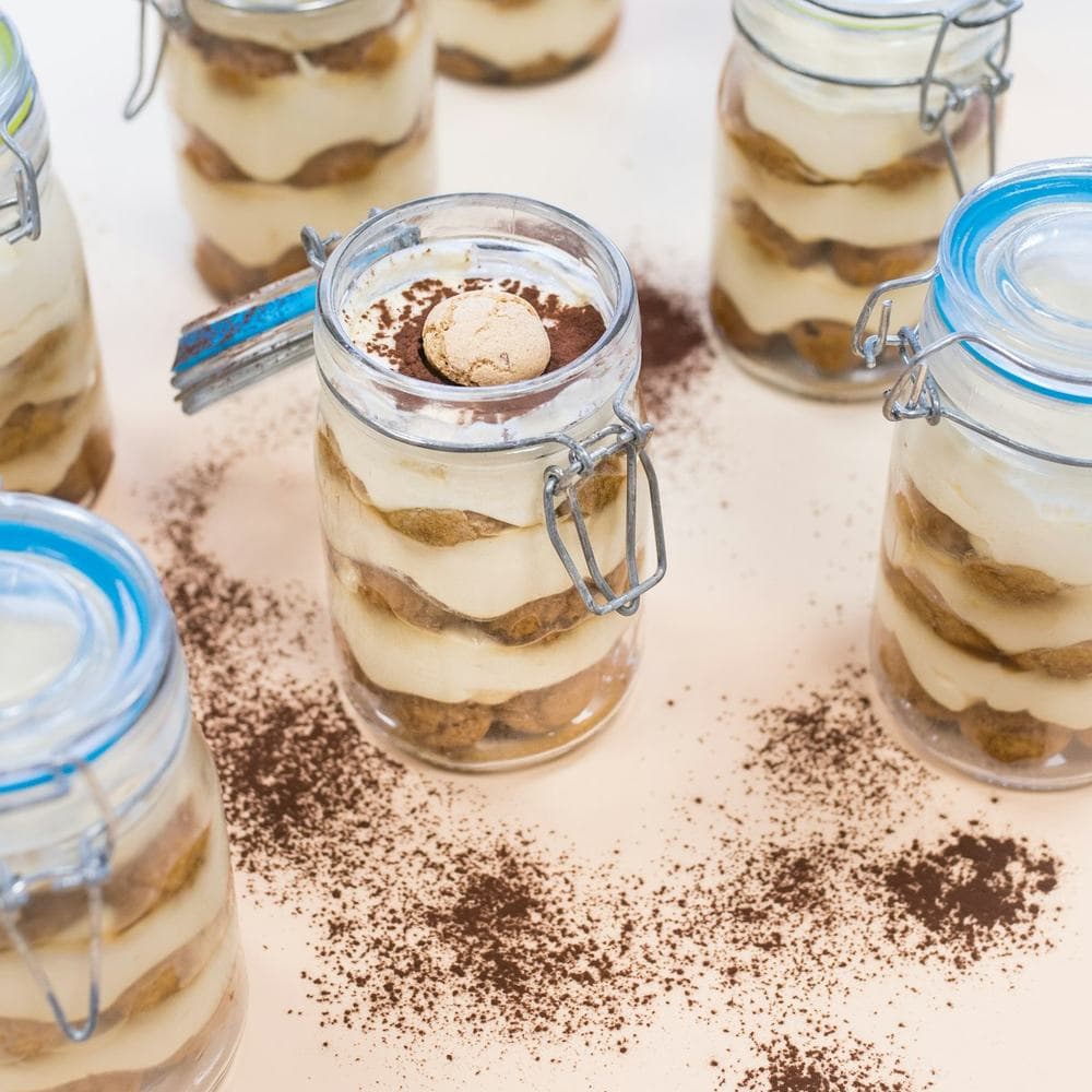 Tiramisu layered in glass jars